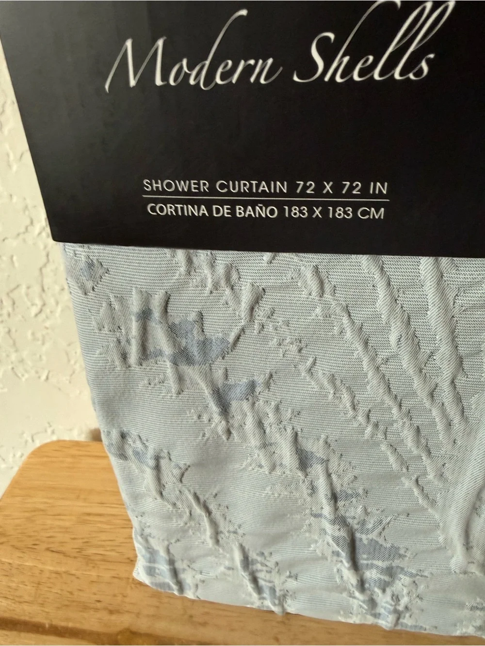 Avanti Modern Shells Shower Curtain in Light Blue.